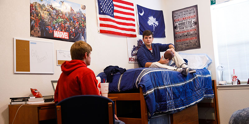 Housing photo of two male students in dorm room