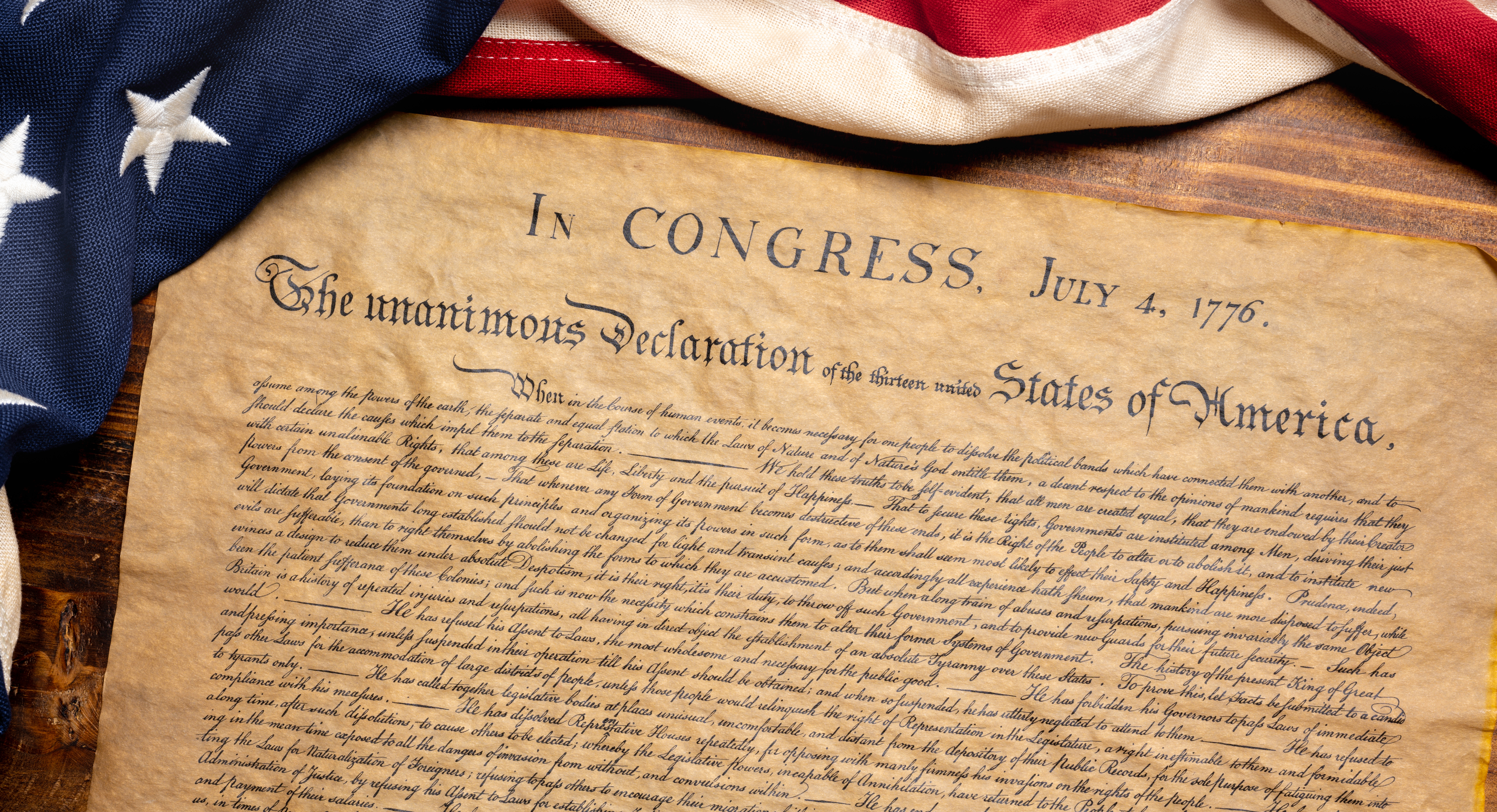 Photo of US Consitution placed with the American flag