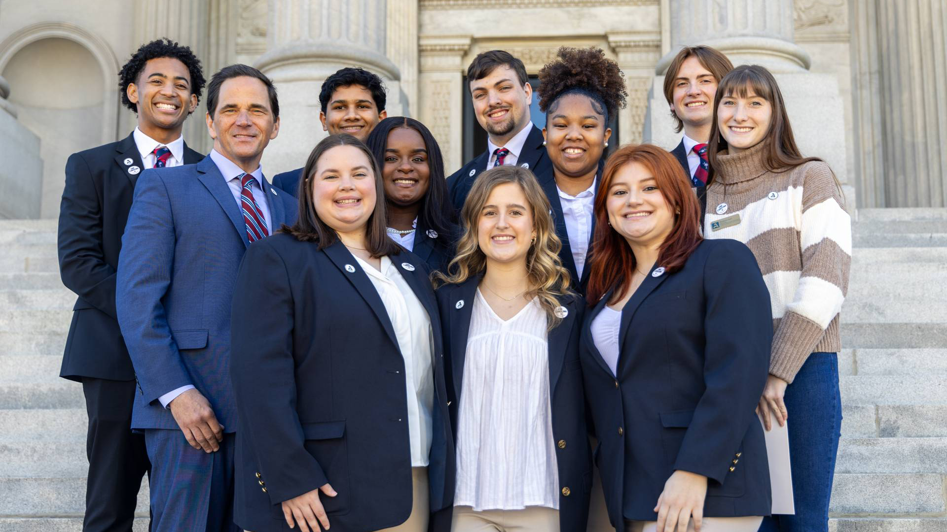 Photo of Chancellor with Chancellor Ambassadors at the State House for Carolina Day