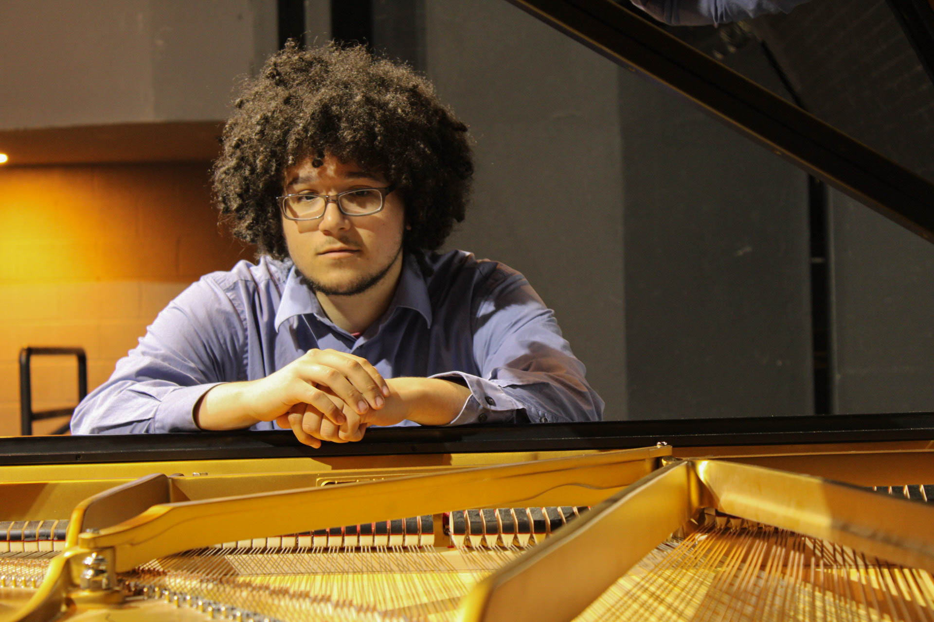 Photo of music student at the Steinway concert grand