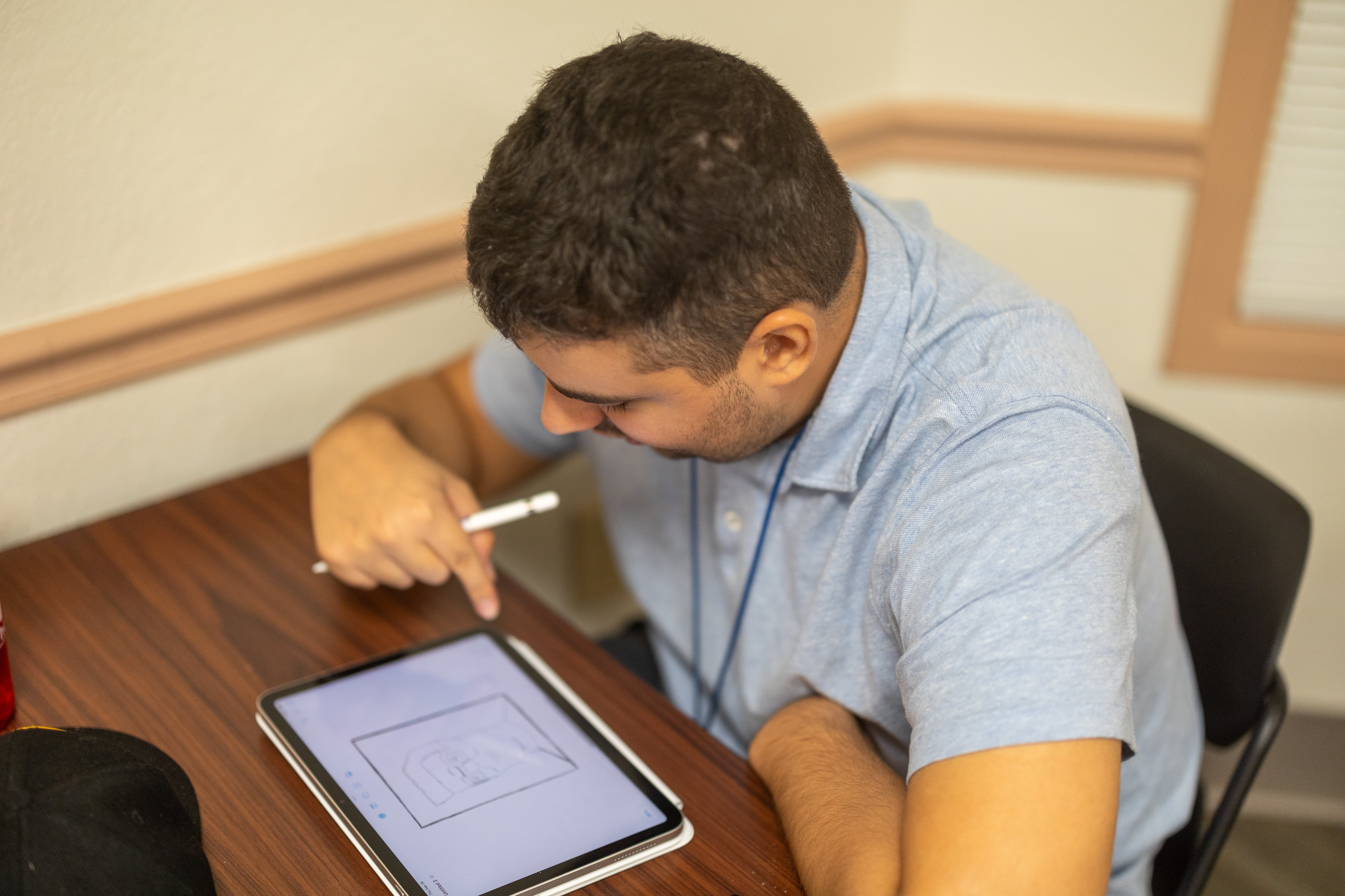 USCA LIFE student enjoys working on assignments using his brand-new iPad Pro provided by the program.