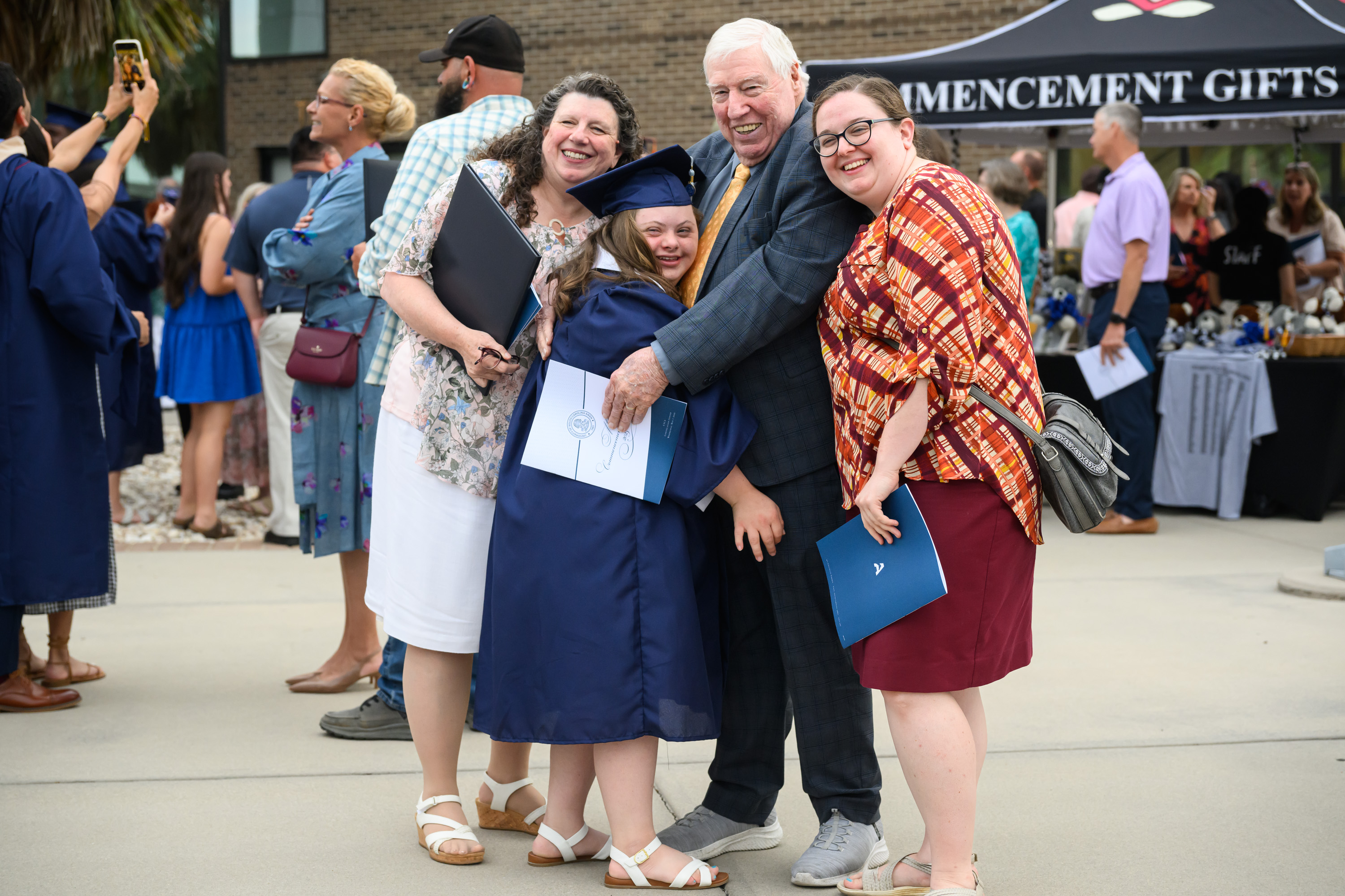 Neva Basset, a USCA LIFE graduate, embraces her family after becoming one of the program’s first graduates.