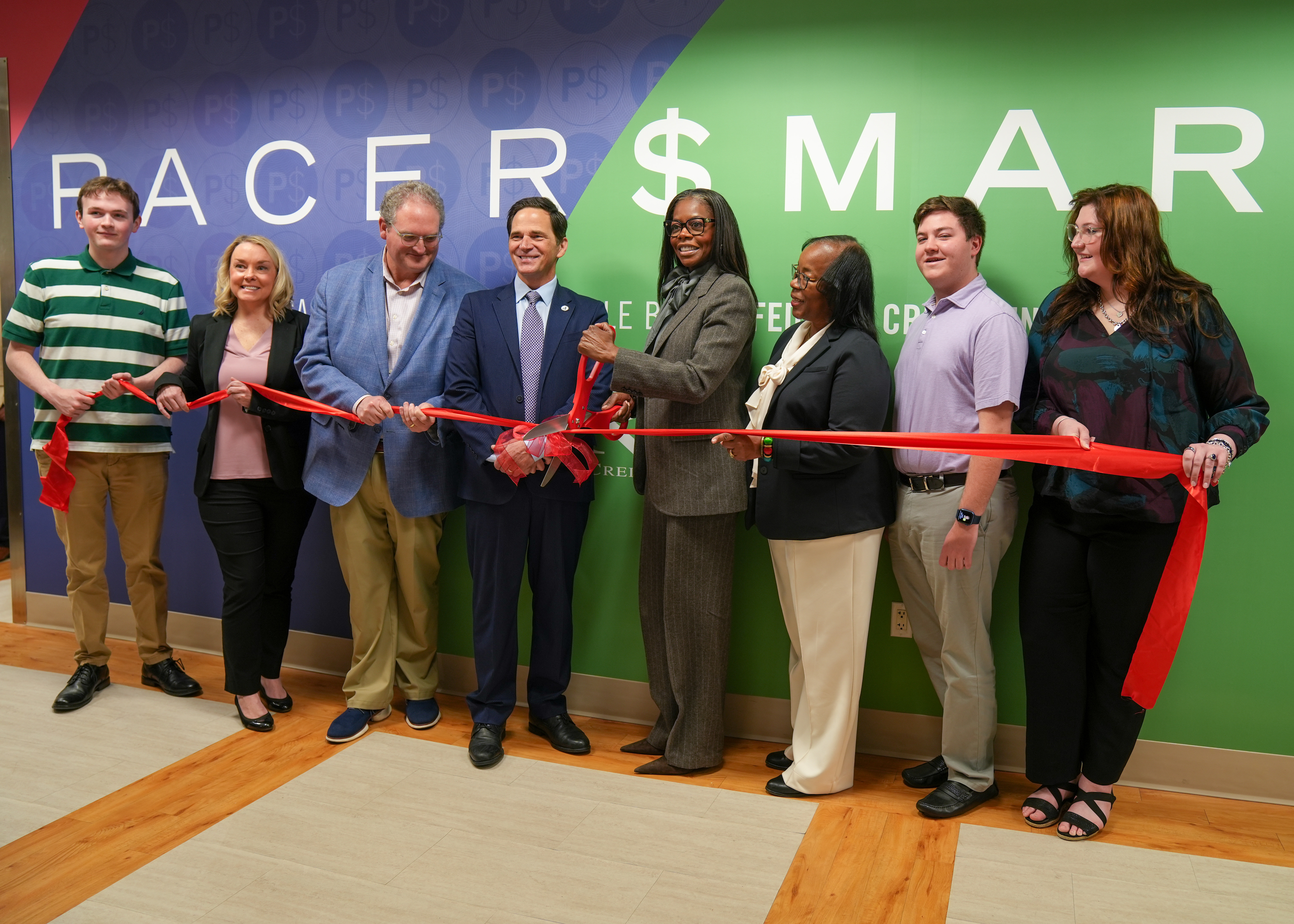 Dr. Daniel Heimmermann (pictured center) joins USCA students, faculty, staff and SRP officials for the official ribbon-cutting ceremony of the Pacer $mart lab.