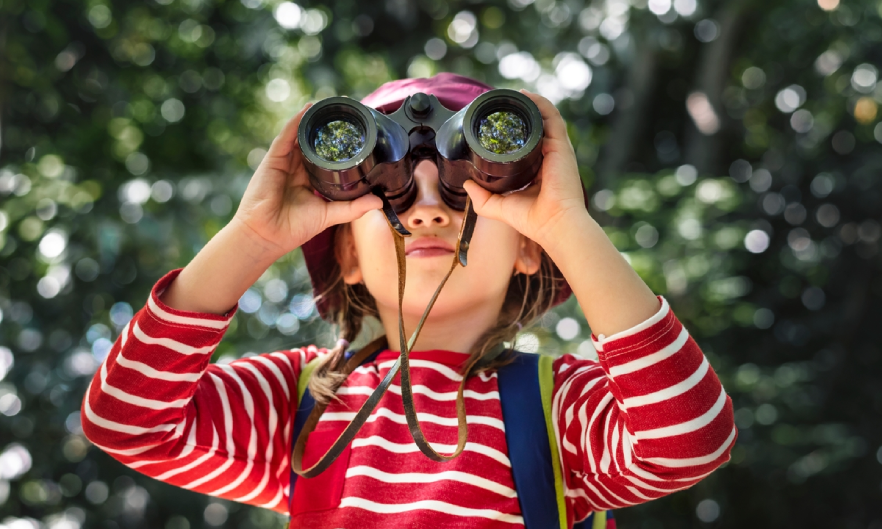 Photo of young girl with binoculars