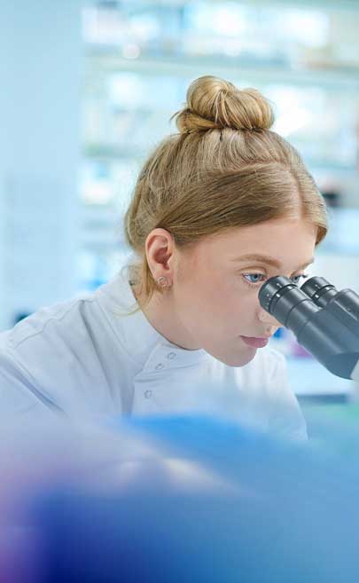 Scientist with microscope
